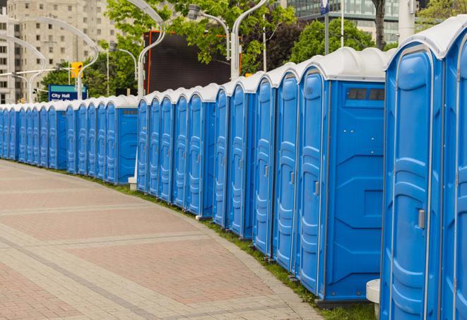 outdoor restroom setup for a special event, with sleek and modern portable restrooms in Ayden